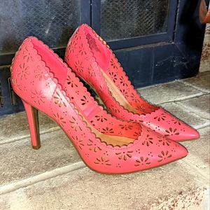 Pink eyelet pumps